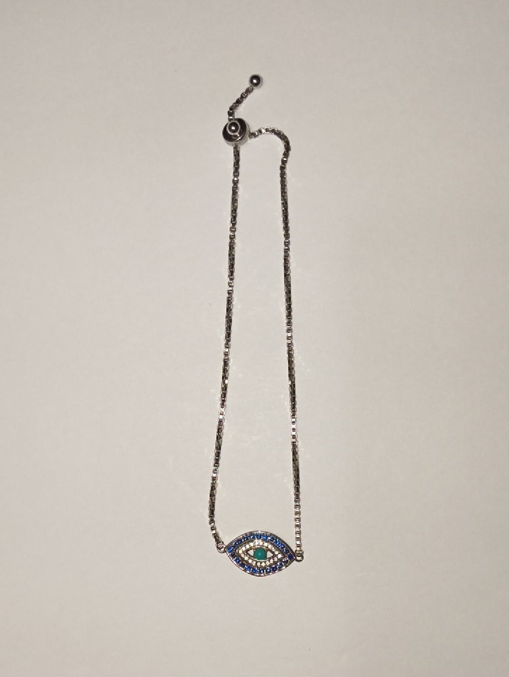 Sterling Silver Evil Eye Bracelet with Blue and Teal Stones
